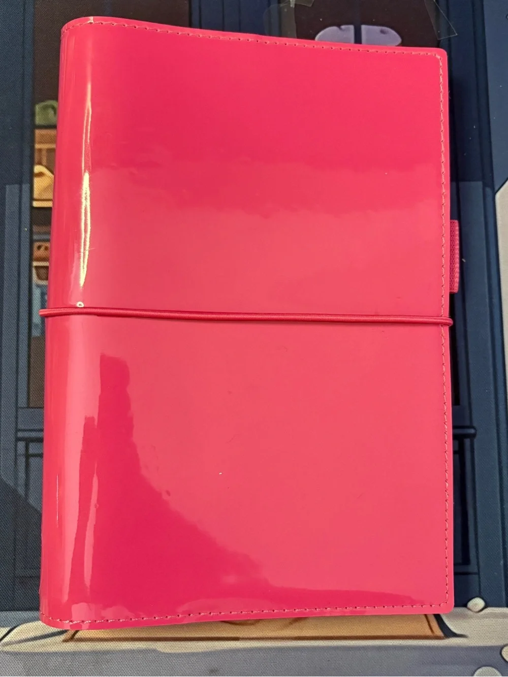 Filofax domino in pink, patent leather, personal size.